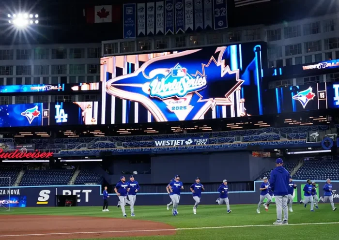 Members of the Los Angeles Dodgers warn up during a World Series baseball media day, Thursday, Oct. 23, 2025, in Toronto. The Toronto Blue Jays face the Los Angeles Dodgers in Game 1 on Friday. (AP Photo/Brynn Anderson)