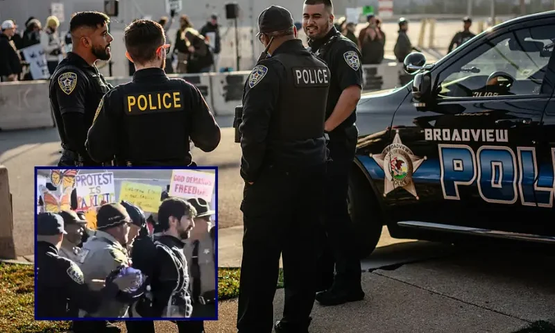 A group of local police officers watch from across the street as demonstrators gather and sing in the "free speech zone" outside the Immigration and Customs Enforcement processing and detention facility on October 31, 2025, in Broadview, Illinois. The Village of Broadview established the restricted protest zone and set curfew hours amid President Donald Trump's administration's "Operation Midway Blitz," an ongoing immigration enforcement surge across the Chicago region. (Photo by Jamie Kelter Davis/Getty Images) / Screen grab of protesters outside of an Immigration and Customs Enforcement (ICE) facility in Broadview, Illinois, on Friday, November 14th, 2025