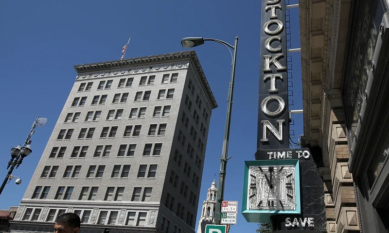 STOCKTON, CA - JUNE 27: A pedestrian walks by the vacant Bank of Stockton on June 27, 2012 in Stockton, California. Members of the Stockton city council voted 6-1 on Tuesday to adopt a spending plan for operating under Chapter 9 bankruptcy protection following failed talks with bondholders and labor unions failed. The move will make Stockton the biggest U.S. city to file for bankruptcy protection from creditors. (Photo by Justin Sullivan/Getty Images)
