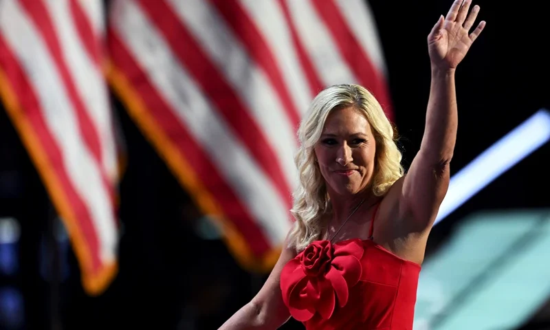 MILWAUKEE, WISCONSIN - JULY 15: U.S. Rep. Marjorie Taylor Greene (R-GA) waves on stage on the first day of the Republican National Convention at the Fiserv Forum on July 15, 2024 in Milwaukee, Wisconsin. Delegates, politicians, and the Republican faithful are in Milwaukee for the annual convention, concluding with former President Donald Trump accepting his party's presidential nomination. The RNC takes place from July 15-18. (Photo by Leon Neal/Getty Images)