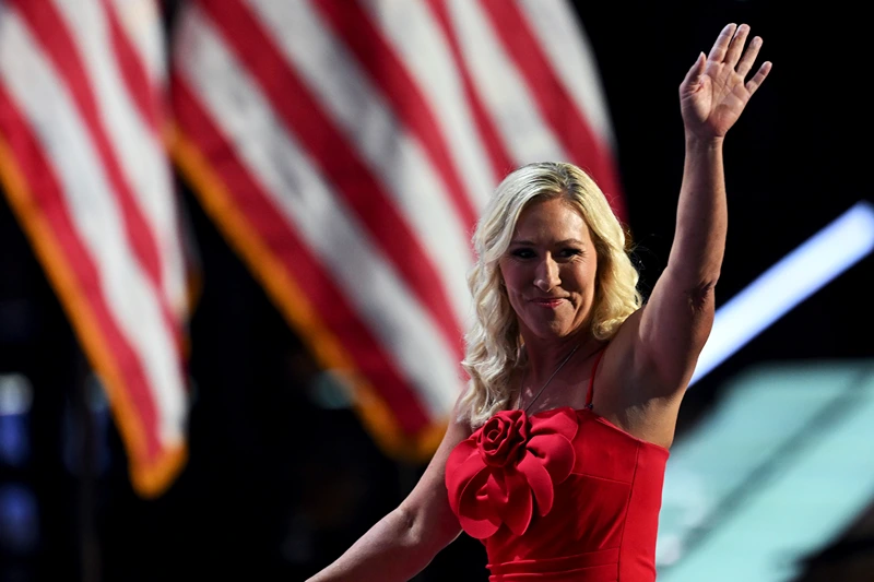 MILWAUKEE, WISCONSIN - JULY 15: U.S. Rep. Marjorie Taylor Greene (R-GA) waves on stage on the first day of the Republican National Convention at the Fiserv Forum on July 15, 2024 in Milwaukee, Wisconsin. Delegates, politicians, and the Republican faithful are in Milwaukee for the annual convention, concluding with former President Donald Trump accepting his party's presidential nomination. The RNC takes place from July 15-18. (Photo by Leon Neal/Getty Images)