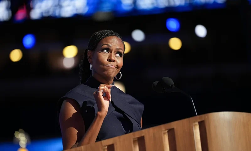 CHICAGO, ILLINOIS - AUGUST 20: Former first lady Michelle Obama speaks on stage during the second day of the Democratic National Convention at the United Center on August 20, 2024 in Chicago, Illinois. Delegates, politicians, and Democratic Party supporters are gathering in Chicago, as current Vice President Kamala Harris is named her party's presidential nominee. The DNC takes place from August 19-22. (Photo by Andrew Harnik/Getty Images)