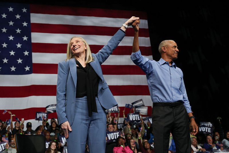 NORFOLK, VIRGINIA - NOVEMBER 01: Former U.S. President Barack Obama (R) and Virginia Democratic gubernatorial candidate, former Rep. Abigail Spanberger raise their arms together during a campaign rally in the Chartway Arena on November 01, 2025 in Norfolk, Virginia. Spanberger will face off against Republican candidate Winsome Earle-Sears in the Commonwealth of Virginia’s off-year election for governor and other statewide offices on November 4. (Photo by Win McNamee/Getty Images)