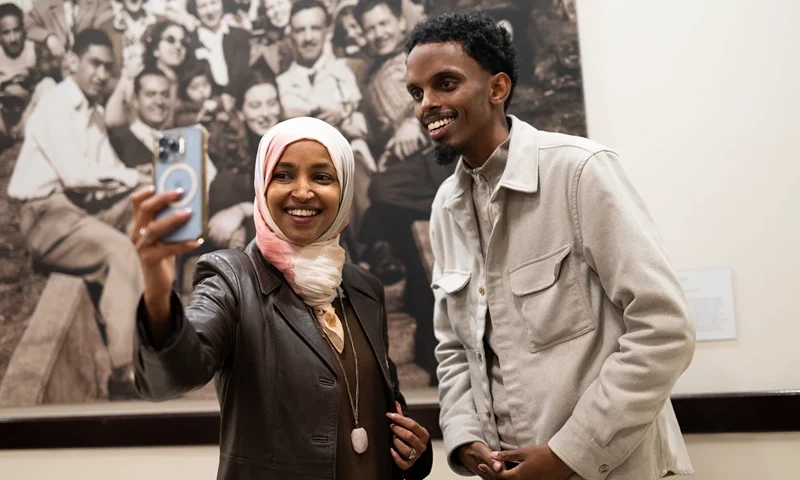 MINNEAPOLIS, MINNESOTA - NOVEMBER 4: Minneapolis mayoral candidate State Senator Omar Fateh (R) records an Instagram live video with Rep. Ilhan Omar (D-MN) as he campaigns on Election Day at the University of Minnesota on November 4, 2025 in Minneapolis, Minnesota. Incumbent Mayor Jacob Frey is seeking reelection to his third term in office as he is opposed by three other local Democrats. (Photo by Stephen Maturen/Getty Images)