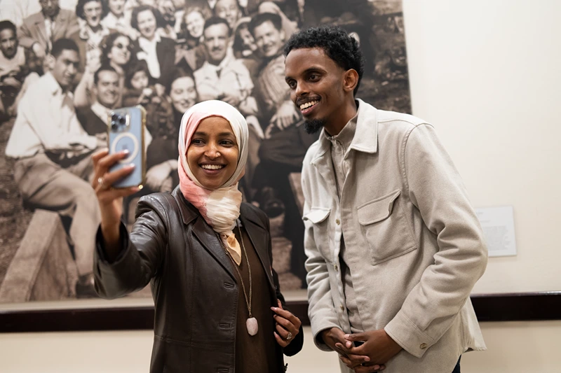 MINNEAPOLIS, MINNESOTA - NOVEMBER 4: Minneapolis mayoral candidate State Senator Omar Fateh (R) records an Instagram live video with Rep. Ilhan Omar (D-MN) as he campaigns on Election Day at the University of Minnesota on November 4, 2025 in Minneapolis, Minnesota. Incumbent Mayor Jacob Frey is seeking reelection to his third term in office as he is opposed by three other local Democrats. (Photo by Stephen Maturen/Getty Images)
