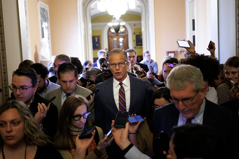 WASHINGTON, DC - NOVEMBER 10: Senate Majority Leader John Thune (R-SD) speaks to reporters while walking to his office on November 10, 2025 on Capitol Hill in Washington, DC. The Senate reached a deal late Sunday to fund the Government, aiming to end the longest shutdown in history. (Photo by Tom Brenner/Getty Images)