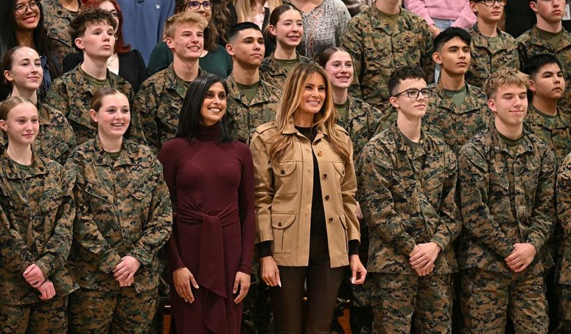 US First Lady Melania Trump and Second Lady Usha Vance (L) pose for a picture with students at Lejeune High School at Marine Corps Base Camp Lejeune in Jacksonville, North Carolina, November 19, 2025, as they travel together to visit military families. (Photo by SAUL LOEB / AFP) (Photo by SAUL LOEB/AFP via Getty Images)