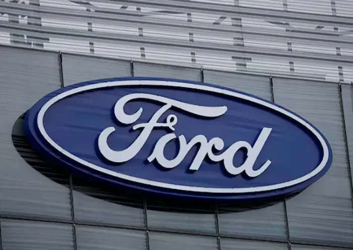 The blue Ford oval logo is displayed on the new Ford World Headquarters in Dearborn, Michigan, U.S. November 16, 2025. REUTERS/Rebecca Cook