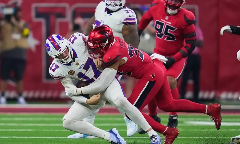 Buffalo Bills quarterback Josh Allen (17) is sacked by Houston Texans linebacker Henry To’oTo’o (39) in the second half of an NFL football game Thursday, Nov. 20, 2025, in Houston. (AP Photo/Ashley Landis)