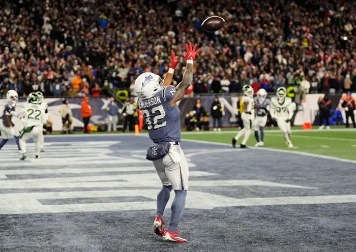 New England Patriots running back TreVeyon Henderson catches a touchdown pass during the second half of an NFL football game against the New York Jets, Thursday, Nov. 13, 2025, in Foxborough, Mass. (AP Photo/Charles Krupa)