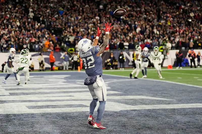 New England Patriots running back TreVeyon Henderson catches a touchdown pass during the second half of an NFL football game against the New York Jets, Thursday, Nov. 13, 2025, in Foxborough, Mass. (AP Photo/Charles Krupa)