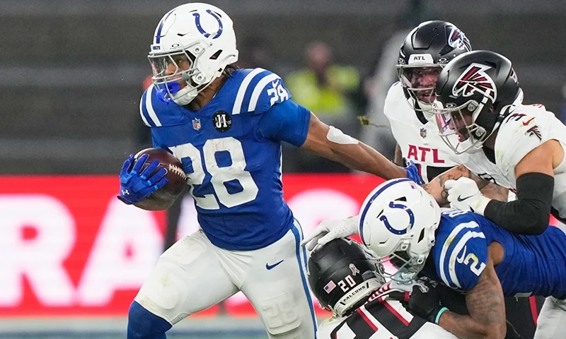 Indianapolis Colts running back Jonathan Taylor (28) runs with the ball during an NFL football game against the Atlanta Falcons, Sunday, Nov. 9, 2025, in Berlin, Germany. (AP Photo/Martin Meissner)