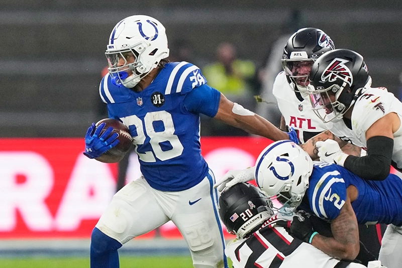 Indianapolis Colts running back Jonathan Taylor (28) runs with the ball during an NFL football game against the Atlanta Falcons, Sunday, Nov. 9, 2025, in Berlin, Germany. (AP Photo/Martin Meissner)