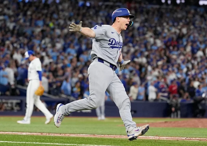 Los Angeles Dodgers’ Will Smith celebrates a home run against the Toronto Blue Jays during the11th inning in Game 7 of baseball’s World Series, Sunday, Nov. 2, 2025, in Toronto. (AP Photo/Brynn Anderson)