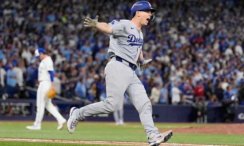 Los Angeles Dodgers’ Will Smith celebrates a home run against the Toronto Blue Jays during the11th inning in Game 7 of baseball’s World Series, Sunday, Nov. 2, 2025, in Toronto. (AP Photo/Brynn Anderson)