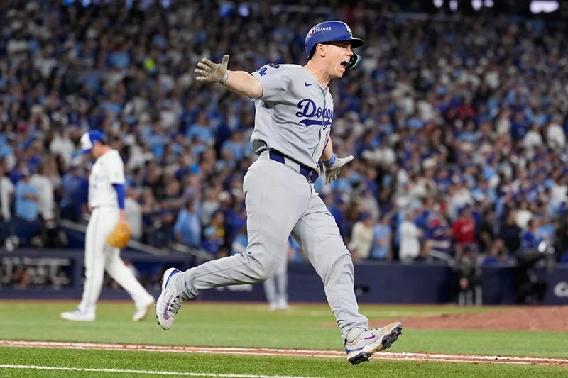 Los Angeles Dodgers’ Will Smith celebrates a home run against the Toronto Blue Jays during the11th inning in Game 7 of baseball’s World Series, Sunday, Nov. 2, 2025, in Toronto. (AP Photo/Brynn Anderson)