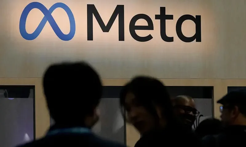 Attendees visit the Meta booth at the Game Developers Conference 2023 in San Francisco on March 22, 2023. (AP Photo/Jeff Chiu, File)