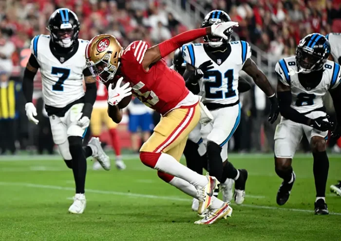 San Francisco 49ers wide receiver Jauan Jennings runs for a touchdown against the Carolina Panthers during the first half an NFL football game, Monday, Nov. 24, 2025, in Santa Clara, Calif. (AP Photo/Eakin Howard)