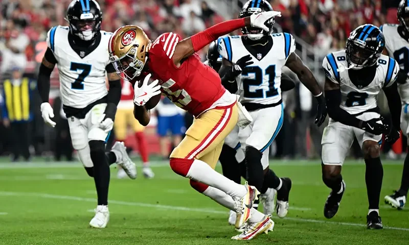 San Francisco 49ers wide receiver Jauan Jennings runs for a touchdown against the Carolina Panthers during the first half an NFL football game, Monday, Nov. 24, 2025, in Santa Clara, Calif. (AP Photo/Eakin Howard)