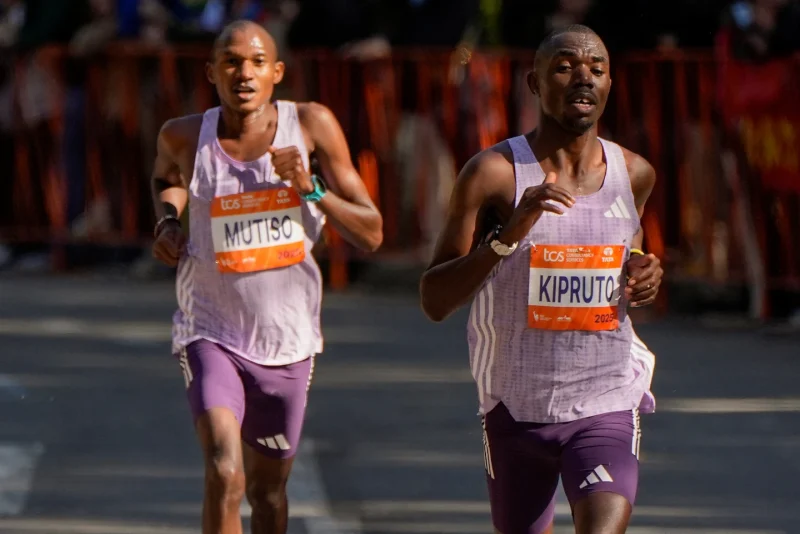 Benson Kipruto and Alexander Mutiso, both of Kenya, make their way through Central Park during the New York City Marathon, Sunday, Nov. 2, 2025, in New York. (AP Photo/Yuki Iwamura)