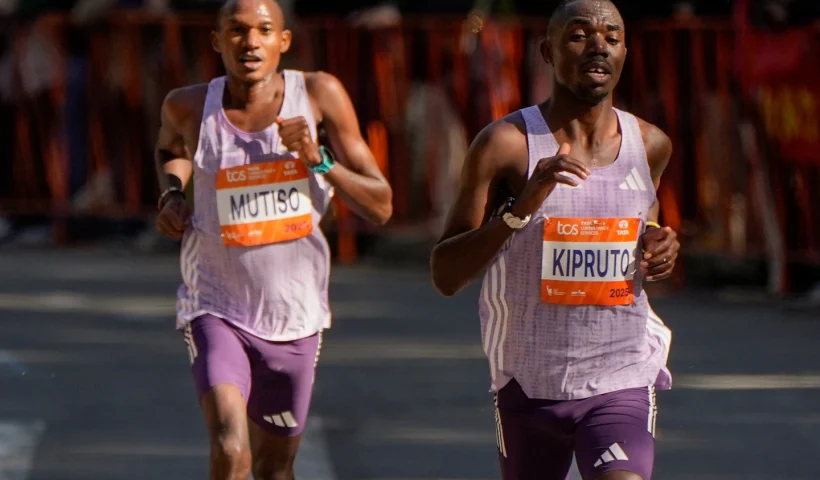 Benson Kipruto and Alexander Mutiso, both of Kenya, make their way through Central Park during the New York City Marathon, Sunday, Nov. 2, 2025, in New York. (AP Photo/Yuki Iwamura)