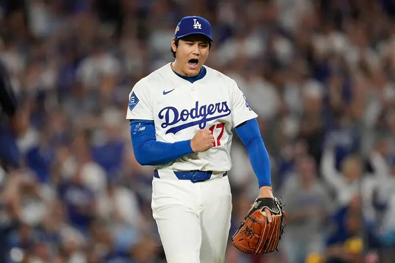 Los Angeles Dodgers pitcher Shohei Ohtani (17) reacts during Game 4 of baseball’s National League Championship Series against the Milwaukee Brewers, Friday, Oct. 17, 2025, in Los Angeles. (AP Photo/Ashley Landis, File)