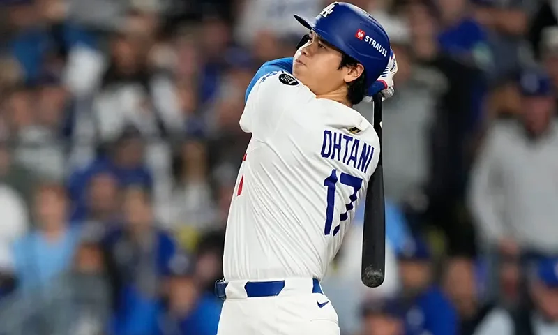 Los Angeles Dodgers’ Shohei Ohtani watches his home run against the Toronto Blue Jays during the seventh inning in Game 3 of baseball’s World Series, Monday, Oct. 27, 2025, in Los Angeles. (AP Photo/Brynn Anderson, File)