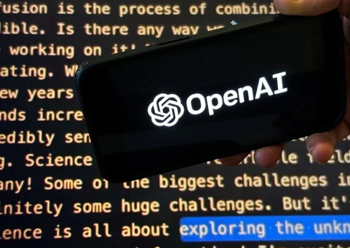 The OpenAI logo appears on a mobile phone in front of a screen showing part of the company website in this photo taken on Nov. 21, 2023 in New York. (AP Photo/Peter Morgan, File)