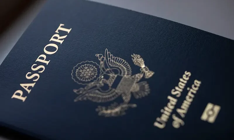The cover of a U.S. Passport is displayed in Tigard, Ore., Saturday, Dec. 11, 2021. (AP Photo/Jenny Kane, File)