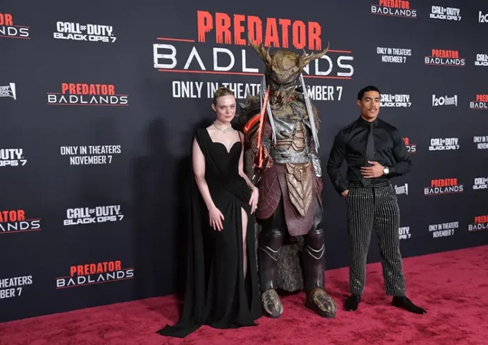 Dimitrius Schuster-Koloamatangi, left, and Elle Fanning arrive at the premiere of “Predator: Badlands” on Monday, Nov. 3, 2025, at TCL Chinese Theatre in Los Angeles. (Photo by Richard Shotwell/Invision/AP)