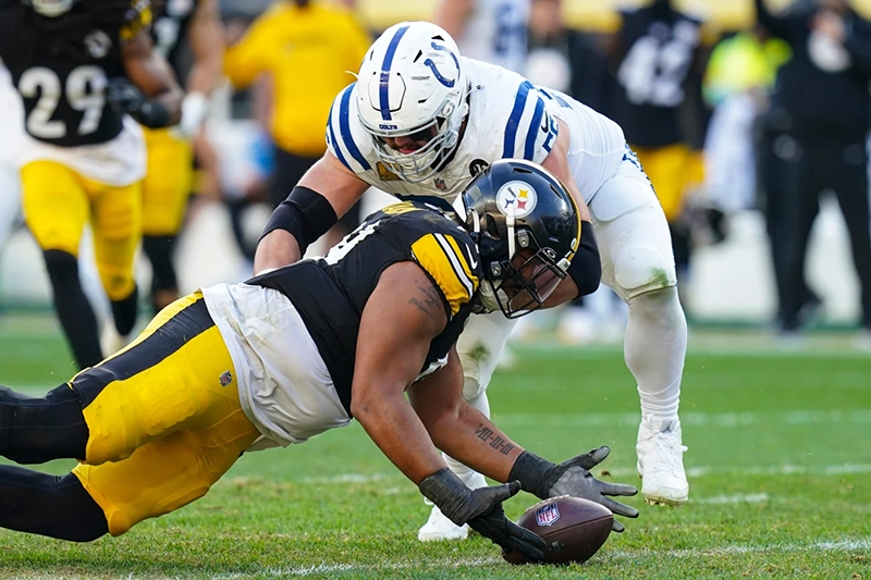 Pittsburgh Steelers defensive tackle Derrick Harmon (99) recovers a fumble in front of Indianapolis Colts guard Quenton Nelson (56) during the second half of an NFL football game in Pittsburgh, Sunday, Nov. 2, 2025. (AP Photo/Matt Freed)