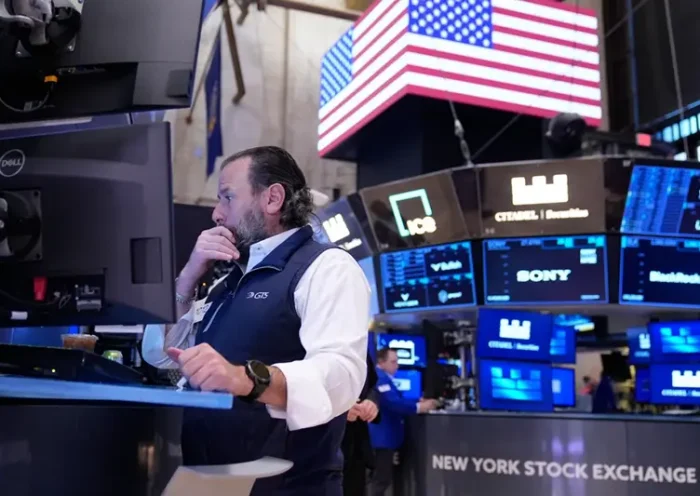 Michael Pistillo works on the floor at the New York Stock Exchange in New York, Tuesday, Nov. 11, 2025. (AP Photo/Seth Wenig)