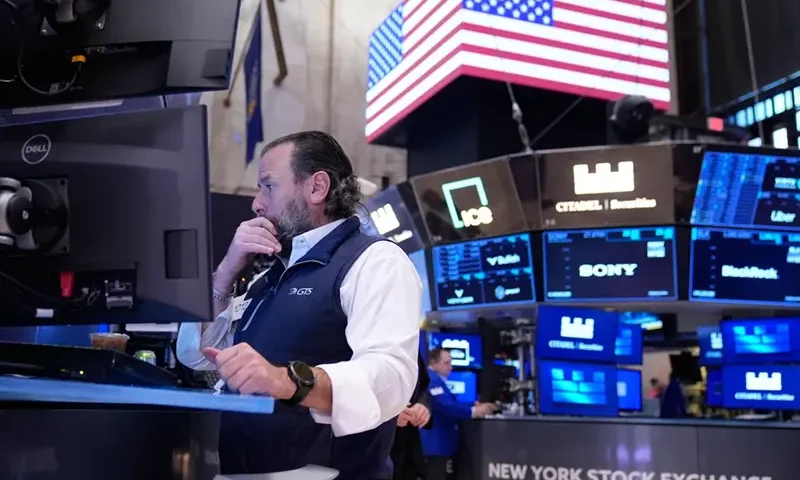 Michael Pistillo works on the floor at the New York Stock Exchange in New York, Tuesday, Nov. 11, 2025. (AP Photo/Seth Wenig)