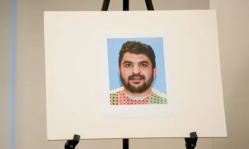 A picture of Rahmanullah Lakanwal, an Afghan national who is the suspect in the shooting of two National Guard members, is displayed at a press conference in Washington, D.C., U.S., November 27, 2025. REUTERS/Nathan Howard