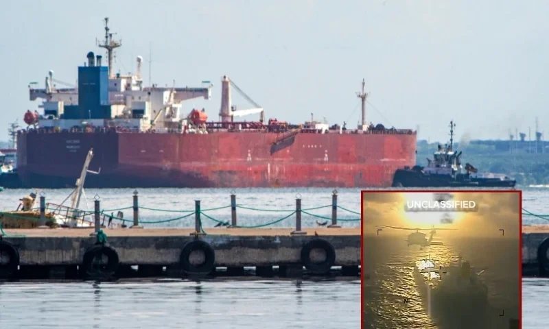 (background) A crude oil tanker is anchored on Lake Maracaibo near Maracaibo, Zulia state, Venezuela, on December 18, 2025. (Alejandro Paredes / AFP via Getty Images) / (R) footage of the declassified Saturday operation by the U.S. Coast Guard released by DHS Secretary Kristi Noem