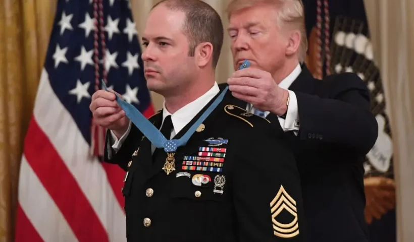 US President Donald Trump presents the Medal of Honor to US Army Master Sergeant Matthew Williams for actions in 2008 in Afghanistan, during a ceremony in the East Room of the White House in Washington, DC, October 30, 2019. (Photo by SAUL LOEB / AFP) (Photo by SAUL LOEB/AFP via Getty Images)