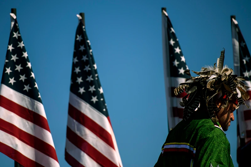 LUMBERTON, NC - OCTOBER 24: People attend a campaign rally for President Donald Trump on October 24, 2020 in Lumberton, North Carolina. President Trump has expressed his support for the Lumbee Indian people to be recognized on a federal level. President Trump continues to campaign against Democratic presidential nominee Joe Biden leading up to the November 3rd Election Day. (Photo by Melissa Sue Gerrits/Getty Images)