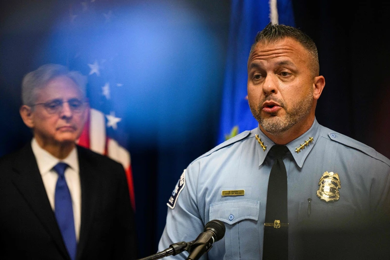 US Attorney General Merrick B. Garland (L) looks on as Minneapolis Police Chief Brian O'Hara (R) addresses the findings of a Justice Department investigation into the Minneapolis Police Department during a press conference in Minneapolis, Minnesota on June 16, 2023. The Department of Justice released a damning report today on the Minneapolis police following the murder of George Floyd by former police officer Derek Chauvin in 2020. (Photo by STEPHEN MATUREN / AFP) (Photo by STEPHEN MATUREN/AFP via Getty Images)