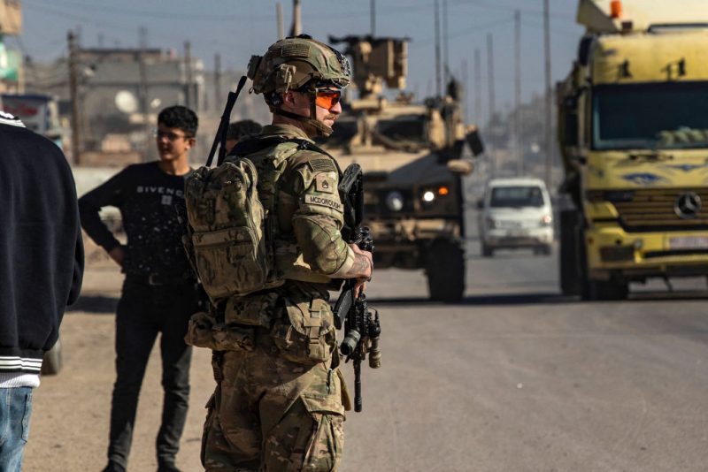 A US soldier keeps watch during a patrol in Syria's northeastern city Qamishli, in the Hasakeh province, mostly controlled by Kurdish-led Syrian Democratic Forces (SDF), on January 9, 2025. Turkey has long been rankled by United States support for the Kurdish-led SDF in northern Syria. Ankara sees the main component of the SDF, the People's Protection Units (YPG), as an extension of its outlawed domestic foe the Kurdistan Workers' Party (PKK). But Washington has long seen the SDF -- which spearheaded the fight that defeated Islamic State group jihadists in 2019 -- as crucial to preventing a jihadist resurgence in the area. (Photo by Delil SOULEIMAN / AFP) (Photo by DELIL SOULEIMAN/AFP via Getty Images)