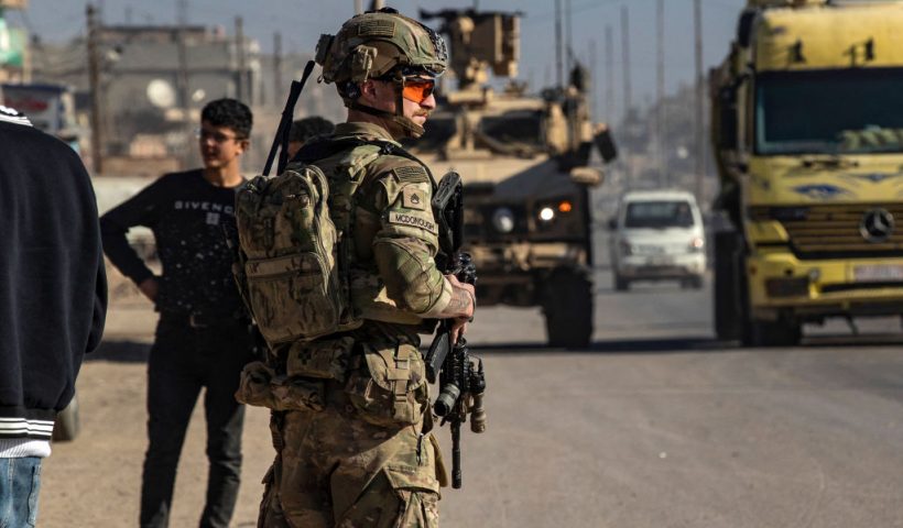 A US soldier keeps watch during a patrol in Syria's northeastern city Qamishli, in the Hasakeh province, mostly controlled by Kurdish-led Syrian Democratic Forces (SDF), on January 9, 2025. Turkey has long been rankled by United States support for the Kurdish-led SDF in northern Syria. Ankara sees the main component of the SDF, the People's Protection Units (YPG), as an extension of its outlawed domestic foe the Kurdistan Workers' Party (PKK). But Washington has long seen the SDF -- which spearheaded the fight that defeated Islamic State group jihadists in 2019 -- as crucial to preventing a jihadist resurgence in the area. (Photo by Delil SOULEIMAN / AFP) (Photo by DELIL SOULEIMAN/AFP via Getty Images)
