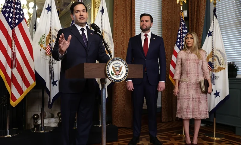WASHINGTON, DC - JANUARY 21: Former U.S. Sen. Marco Rubio (R-FL) (L) speaks as Vice President J.D. Vance (2nd L) as his wife Jeanette Dousdebes Rubio (R) listen during a swearing in ceremony at the Vice President’s ceremonial office at Eisenhower Executive Office Building January 21, 2025 in Washington, DC. Rubio has been sworn in as the 72nd U.S. Secretary of State. (Photo by Alex Wong/Getty Images)