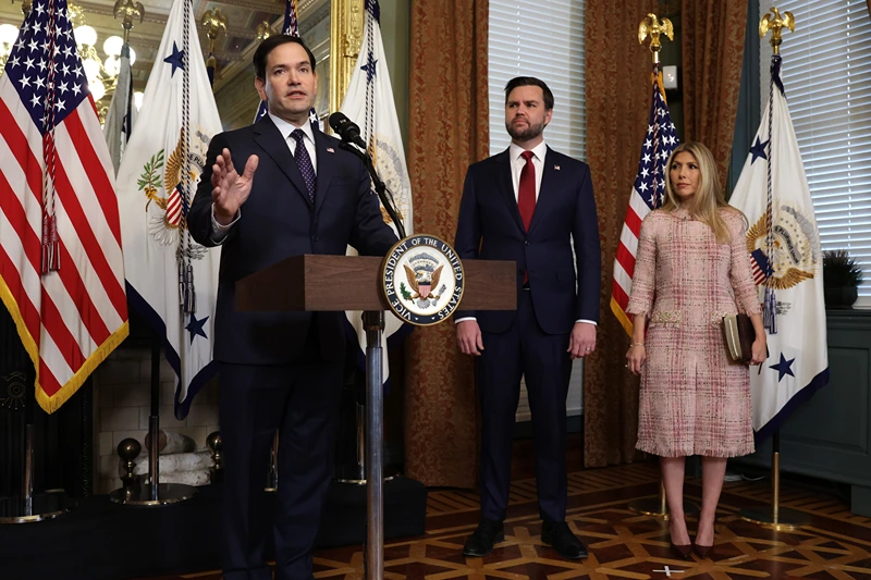 WASHINGTON, DC - JANUARY 21: Former U.S. Sen. Marco Rubio (R-FL) (L) speaks as Vice President J.D. Vance (2nd L) as his wife Jeanette Dousdebes Rubio (R) listen during a swearing in ceremony at the Vice President’s ceremonial office at Eisenhower Executive Office Building January 21, 2025 in Washington, DC. Rubio has been sworn in as the 72nd U.S. Secretary of State. (Photo by Alex Wong/Getty Images)