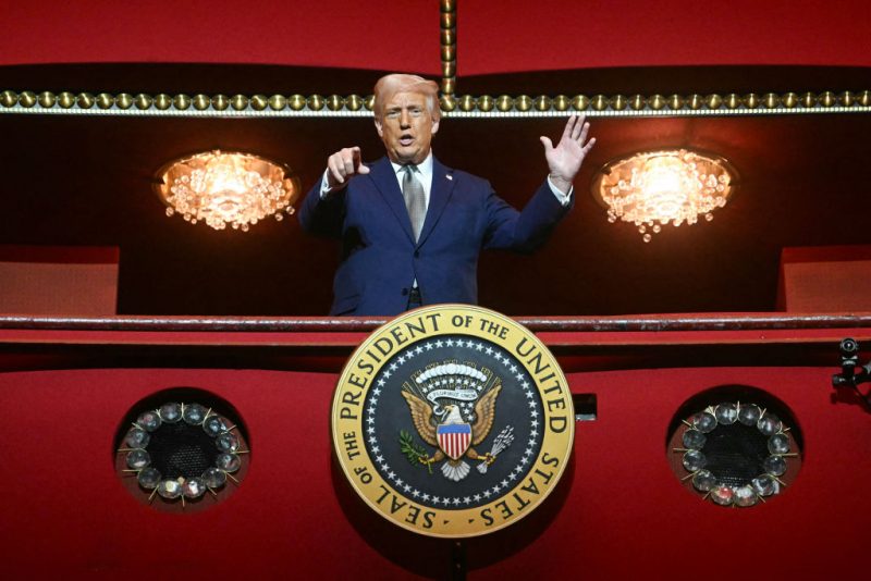 TOPSHOT - US President Donald Trump stands in the presidential box as he tours the John F. Kennedy Center for the Performing Arts in Washington, DC, on March 17, 2025. Trump was appointed chairman of the Kennedy Center on February 12, 2025, as a new board of trustees loyal to the US president brought his aggressive rightwing, anti-"woke" stamp to Washington's premier arts venue. (Photo by Jim WATSON / AFP) (Photo by JIM WATSON/AFP via Getty Images)