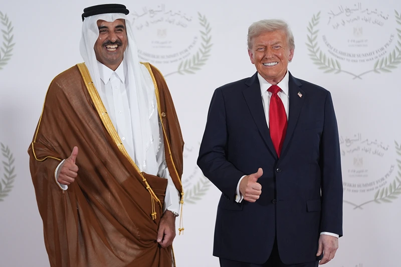 SHARM EL-SHEIKH, EGYPT - OCTOBER 13: President Donald Trump poses with Qatar Prime Minister and Foreign Minister Sheikh Mohammed bin Abdulrahman bin Jassim Al Thani during a world leaders' summit on ending the Gaza war on October 13, 2025 in Sharm El-Sheikh, Egypt. President Trump is in Egypt to meet with European and Middle Eastern leaders in what’s being billed as an international peace summit, following the start of a US-brokered ceasefire deal to end the war in the Gaza Strip. (Photo by Evan Vucci - Pool / Getty Images)