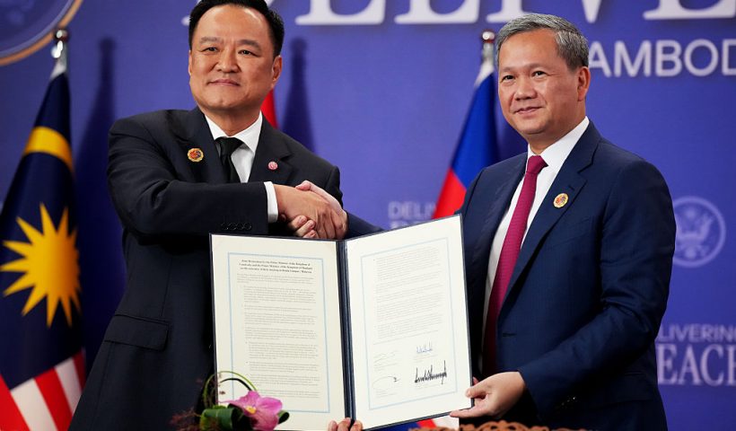 KUALA LUMPUR, MALAYSIA - OCTOBER 26: Thai Prime Minister Anutin Charnvirakul and Cambodian Prime Minister Hun Manet shake hands following the signing of a Cambodia-Thailand peace deal at Kuala Lumpur Convention Centre on October 26, 2025 in Kuala Lumpur, Malaysia. Trump is in Malaysia for the Association of Southeast Asian Nations (ASEAN) summit, and will next travel to Japan, en route to South Korea for the Asia-Pacific Economic Cooperation (APEC) forum. (Photo by Andrew Harnik/Getty Images)