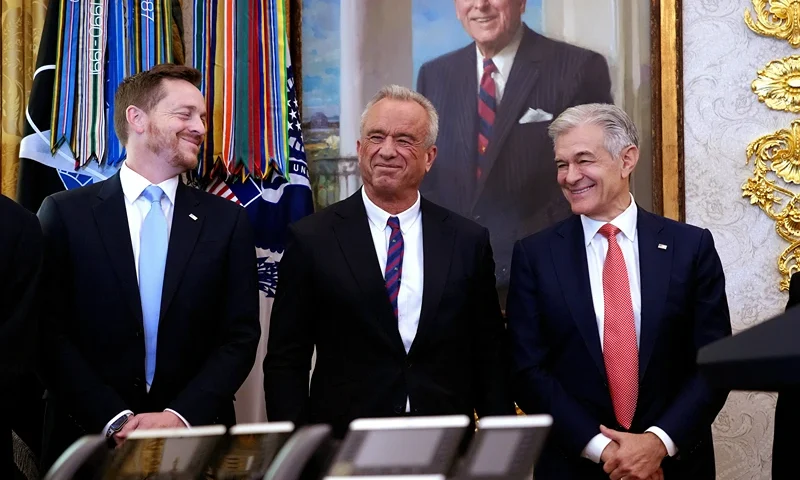 WASHINGTON, DC - NOVEMBER 06: Director of Medicare and Deputy Administrator of CMS Chris Comp (L), Health and Human Services Secretary Robert F. Kennedy Jr., and Administrator for the Centers for Medicare & Medicaid Services Dr. Mehmet Oz stand together while President Donald Trump delivers remarks on lowering drug prices in the Oval Office at the White House on November 06, 2025 in Washington, DC. Trump announced that his administration has reached agreements with drugmakers Eli Lilly and Novo Nordisk that would lower the price of some GLP-1 weight loss medications. (Photo by Andrew Harnik/Getty Images)