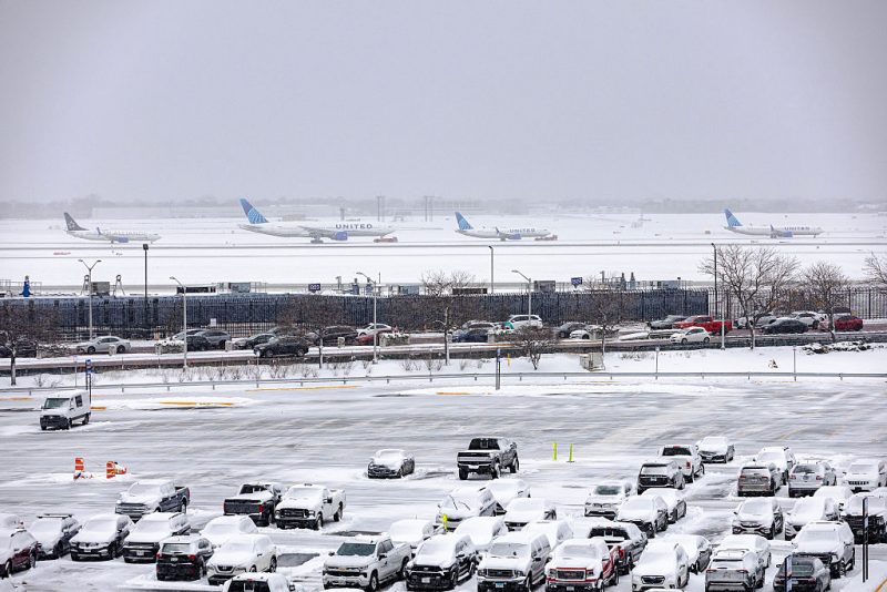 CHICAGO, ILLINOIS - NOVEMBER 30: Several planes wait in line to taxi down a runway after a winter snow storm affected the area at O'Hare International airport on November 30, 2025 in Chicago, Illinois. Close to seven inches of snow were measured at O'Hare as the Federal Aviation Administration is dealing with busy Thanksgiving travel and is expected to have more than 360,000 flights to their destinations. (Photo by Jim Vondruska/Getty Images)