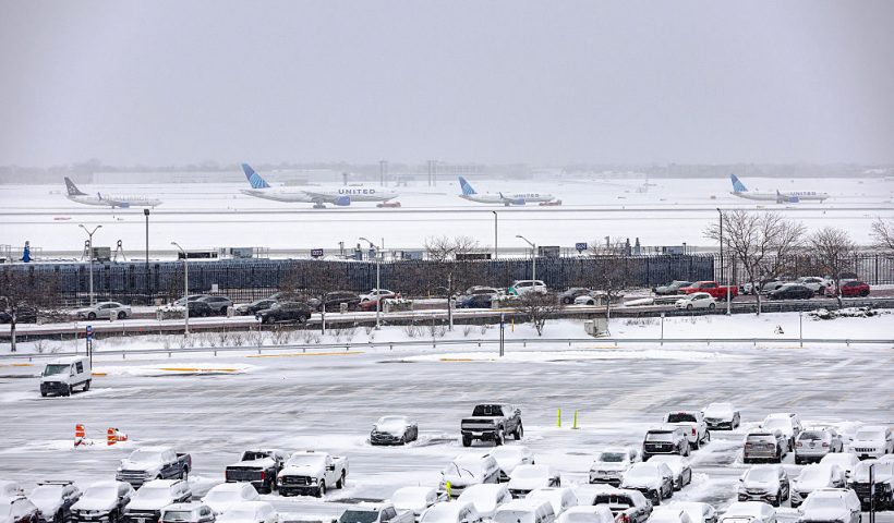 CHICAGO, ILLINOIS - NOVEMBER 30: Several planes wait in line to taxi down a runway after a winter snow storm affected the area at O'Hare International airport on November 30, 2025 in Chicago, Illinois. Close to seven inches of snow were measured at O'Hare as the Federal Aviation Administration is dealing with busy Thanksgiving travel and is expected to have more than 360,000 flights to their destinations. (Photo by Jim Vondruska/Getty Images)