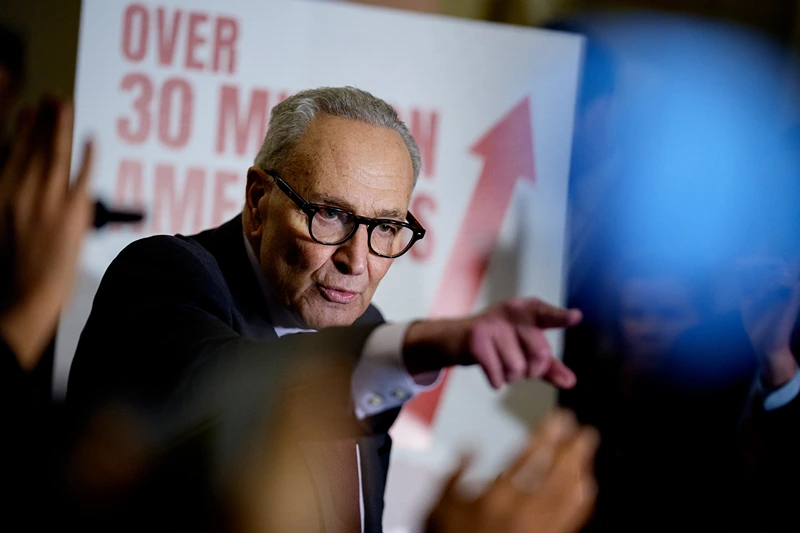 WASHINGTON, DC - DECEMBER 2: Senate Minority Leader Chuck Schumer (D-NY) takes a question from a reporter following a Democratic policy luncheon at the U.S. Capitol Building on December 2, 2025, in Washington, DC. Schumer focused his remarks on healthcare and took questions on boat strikes by the U.S. military in the Caribbean, security for elected officials, upcoming elections in the Senate and other topics. (Photo by Andrew Harnik/Getty Images)