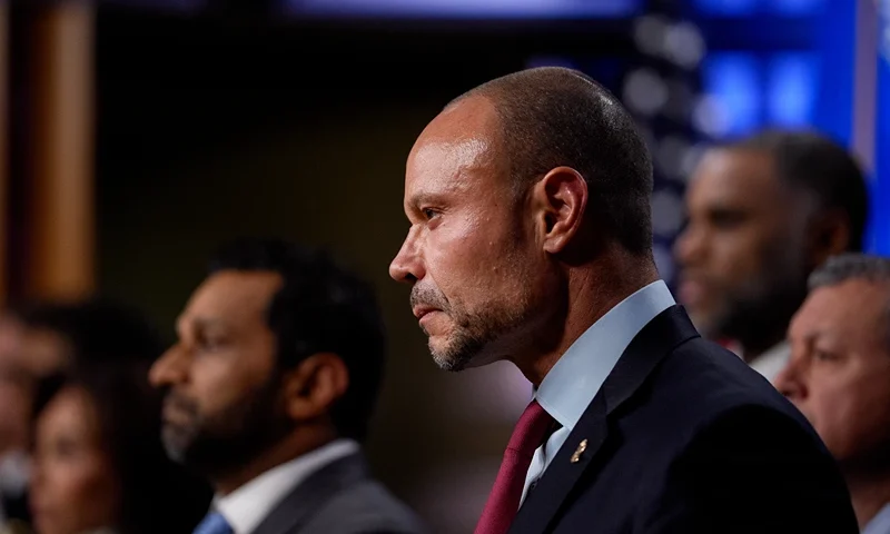 WASHINGTON, DC - DECEMBER 4: FBI Deputy Director Dan Bongino (C) attends a news conference on an arrest of a suspect in the January 6th pipe bombing case at the Department of Justice on December 4, 2025 in Washington, DC. Federal agents have arrested a suspect they are charging with placing two pipe bombs, which never exploded, the night before the January 6th, 2021 U.S. Capitol attack. (Photo by Andrew Harnik/Getty Images)